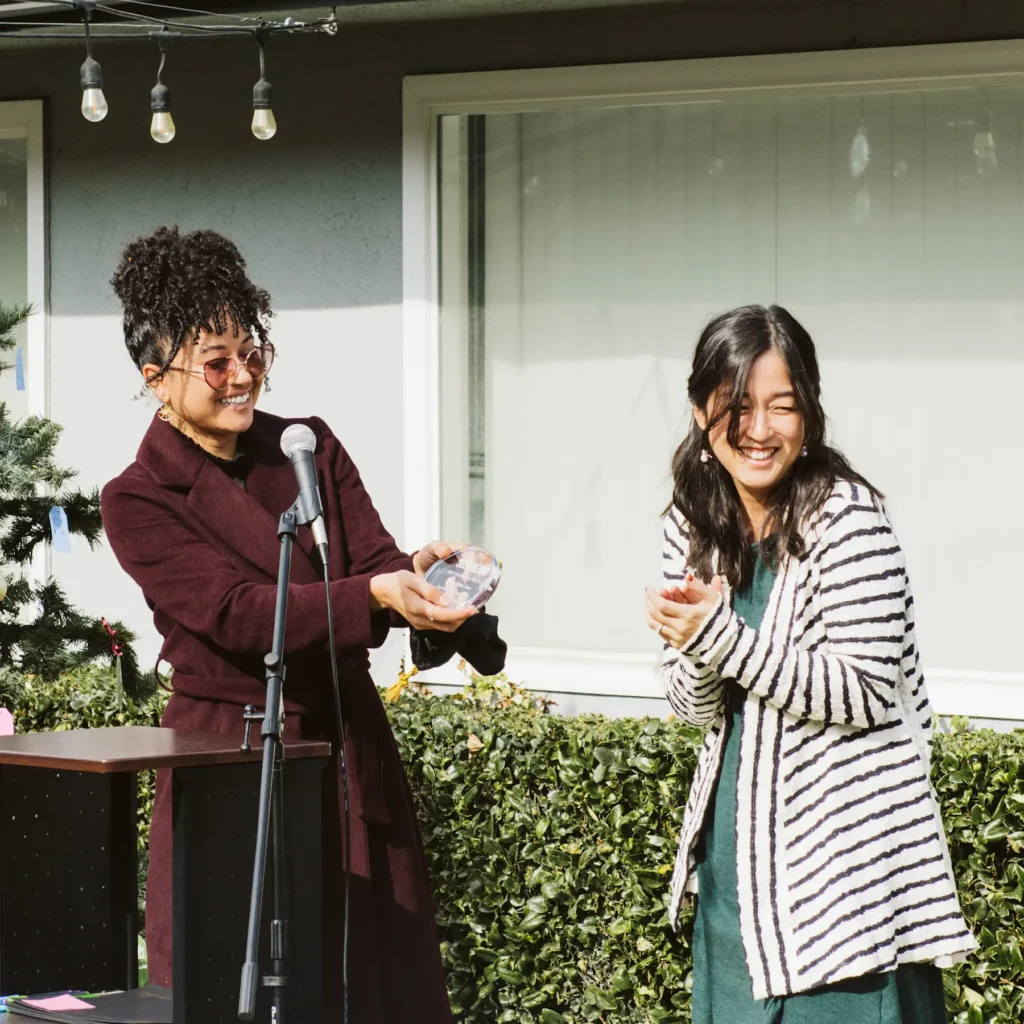 Two women behind microphone